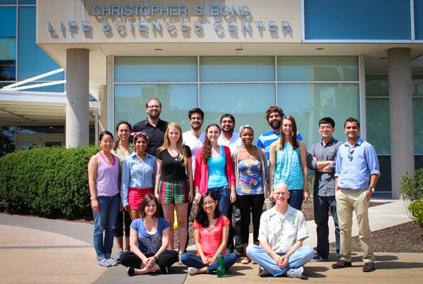 Members of the Burke Lab, including Donald Burke (lower right) in front of the Christopher S. Bond Life Sciences Center at the University of Missouri, Summer 2014.