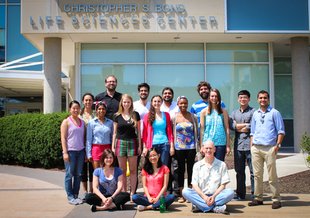 Members of the Burke Lab, including Donald Burke (lower right) in front of the Christopher S. Bond Life Sciences Center at the University of Missouri, Summer 2014.