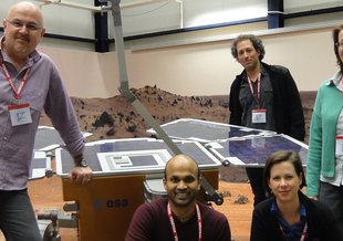 Manish Patel and the NOMAD science team with a prototype of the ExoMars rover in the Mars Yard at ESTEC in the Netherlands.