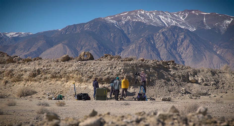 Standing in for a rover, a field team sets up equipment in a dry lakebed in the Nevada desert in February 2020. As part of the exercise, scientists spread around the world sent commands for images and data, as they will once Perseverance lands on Mars.