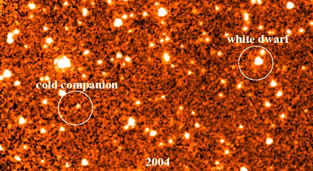 NASA's Spitzer Space Telescope captured this picture of a nearby star and its orbiting companion. The two infrared images show a faint object moving through space together with a dead star called a white dwarf.