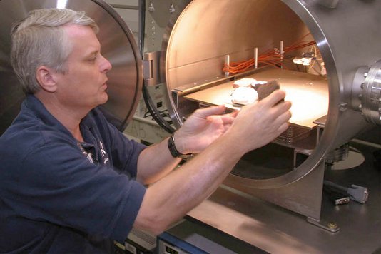 Andrew Schuerger placing samples in a Mars chamber at the University of Florida.