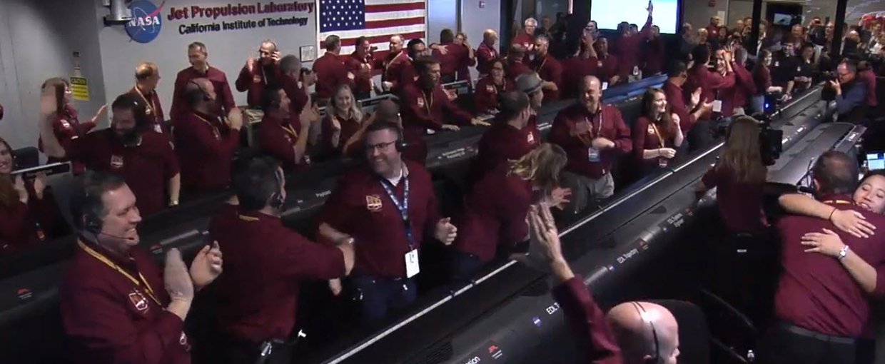 The NASA InSight team reacts after receiving confirmation that the spacecraft successfully touched down on the surface of Mars, inside the Mission Support Area at NASA's Jet Propulsion Laboratory in Pasadena, California.