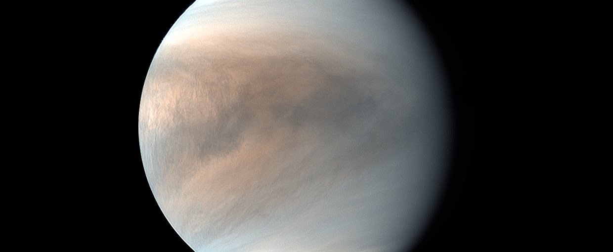 The thick atmosphere of Venus can be seen in this image captured by the Akatsuki orbiter. This is a synthesized false color image of Venus using 283-nm and 365-nm images.