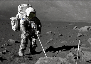 Astronaut Alan L. Bean, Lunar Module pilot for the Apollo 12 lunar landing mission holds a container filled with lunar soil collected while exploring the lunar surface. Credit: NASA.