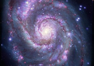 A composite image of M51 with X-rays from Chandra and optical light from NASA's Hubble Space Telescope contains a box that marks the location of the possible planet candidate.