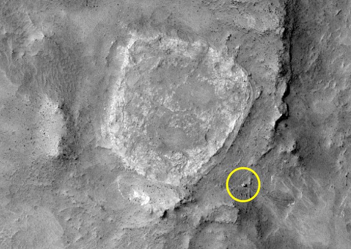 Home Plate is a ancient and eroded volcanic ash deposit about 100 yards across that lies in Gusev Crater's Columbia Hills. At some point in the past a hot spring was active here, producing silica outcrops that appear nearly identical to features found at the El Tatio hot springs in Chile. The silica outcrops lie next to Home Plate's right edge, near the Spirit rover (circled). Credit: NASA/JPL-Caltech/University of Arizona