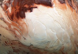 The bright white region of this image shows the icy cap that covers Mars’ south pole, composed of frozen water and frozen carbon dioxide. ESA’s Mars Express imaged this area of Mars on Dec. 17, 2012.
