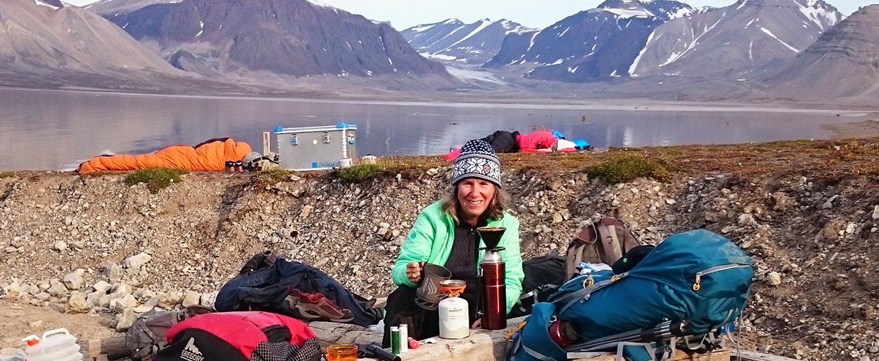 Marilyn Fogel working at a field site.