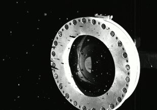 Artist’s concept of NASA’s OSIRIS-REx spacecraft preparing to take a sample from asteroid Bennu.