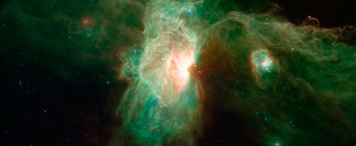 Orion Molecular Cloud Complex, dominated in the center of this view by the brilliant Flame nebula (NGC 2024). The smaller, glowing cavity falling between the Flame nebula and the Horsehead is called NGC 2023.