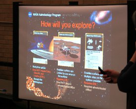 Early on in the AstrobioBound! game, incarcerated youth must decide what kind of mission their team will send to explore our Solar System and search for life – orbiter, lander, or rover.