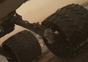 This photo was taken on March 19, 2017, by the Mars Hand Lens Imager camera on the arm of NASA's Curiosity rover. The image helped mission team members inspect the condition of Curiosity’s six wheels.