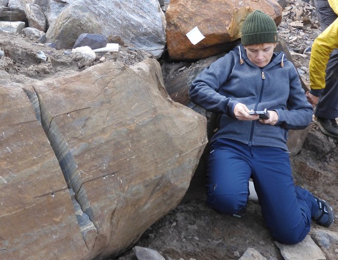 Abigail Allwood at Site A, measuring the orientation of lines and planes with a Brunton compass.