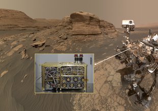 “Selfie” of the Curiosity rover with inset showing the SAM instrument prior to installation on the rover. In this image, the rover is in front of Mount Mercou, a 19.7-foot (6-meter) tall outcrop, and next to the “Nontron” sampling site.