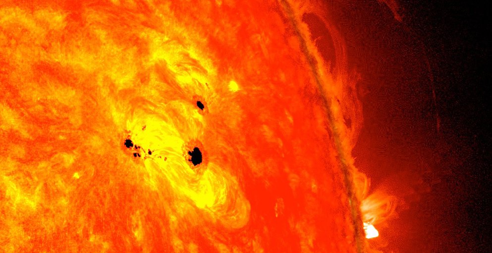 The bottom two black spots on the sun, known as sunspots, appeared quickly over the course of Feb. 19-20, 2013