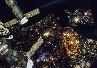 A nighttime view of Western Europe is captured by crew members aboard the International Space Station. England is in the top right, Paris is the bright city near the middle. Belgium and the Netherlands occupying the middle-right of frame.