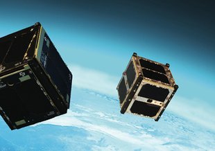 Artist's concept of the Intelligent Payload Experiment (IPEX) and M-Cubed/COVE-2, two NASA Earth-orbiting cube satellites ("CubeSats") that were launched as part of the NROL-39 GEMSat mission from California's Vandenberg Air Force Base on Dec. 5, 2013.