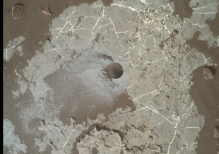 This image shows the Highfield drill hole made by NASA’s Curiosity rover as it was collecting a sample on Vera Rubin Ridge in Gale crater on Mars. Drill powder from this hole was enriched in carbon 12.