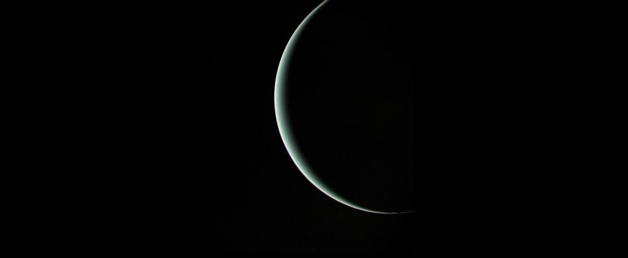 Voyager 2 captured this moody parting shot of Uranus as the spacecraft sped off toward its next adventure at Neptune.