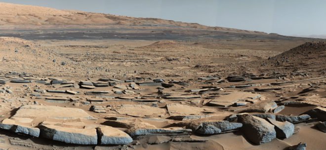 Sedimentary rocks of the Kimberley Formation in Gale Crater, as photographed in 2015. The crater contains thick deposits of finely-laminated mudstone from fine-grained sediments deposited in a standing body of water that persisted for a long period of time.  Scientists have now reported several detections of organic compounds — the building blocks of life in Gale Crater samples. (NASA/JPL-Caltech/MSSS)