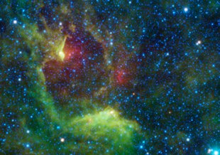 NASA's Wide-field Infrared Survey Explorer, or WISE, captured this colorful image of the reflection nebula IRAS 12116-6001. This cloud of interstellar dust cannot be seen directly in visible light, bu