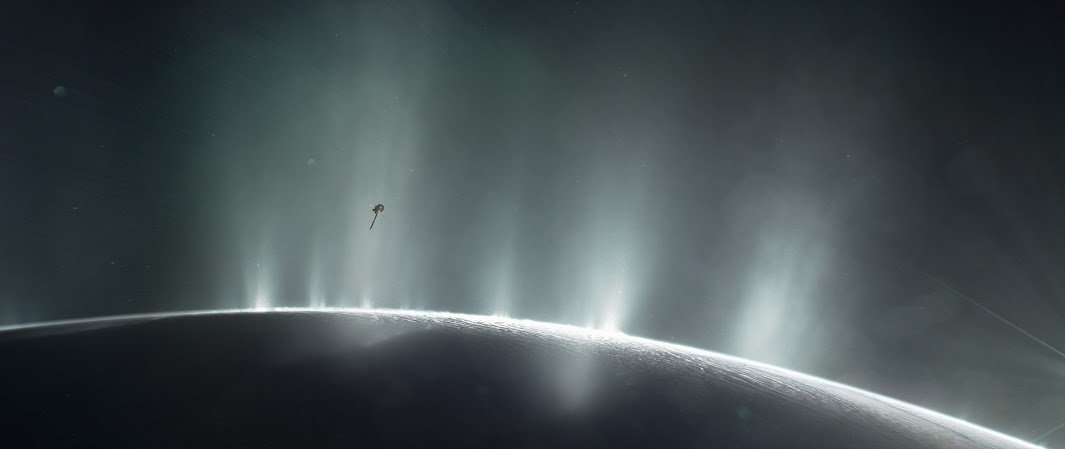 Artist impression of NASA's Cassini spacecraft dives through the plume of Saturn's moon Enceladus in 2015.