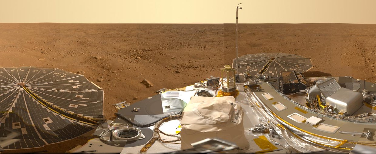 This Mars panorama from the Phoenix Lander is a digital combination of over 100 camera pointings and surveys fully 360 degrees around the busy robotic laboratory.