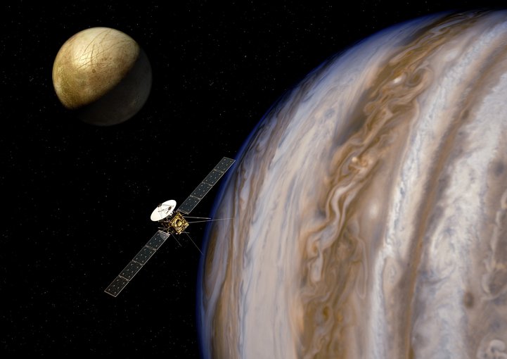 Artist’s impression of the Jupiter Icy Moons Explorer (JUICE) near Jupiter and one of its moons, Europa. Credit: ESA/AOES