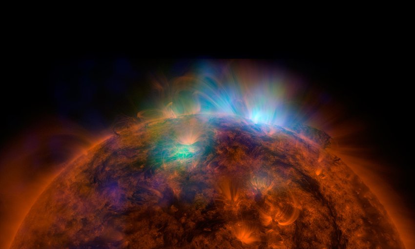X-rays stream off the Sun in this image showing observations by NASA's Nuclear Spectroscopic Telescope Array, or NuSTAR, overlaid on a picture taken by NASA's Solar Dynamics Observatory (SDO).