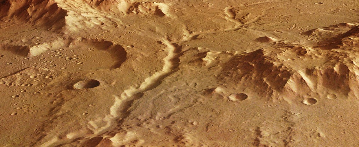 A perspective view of an ancient river channel in the Libya Montes region of Mars, created by the DLR high-resolution stereo camera on board Mars Express.