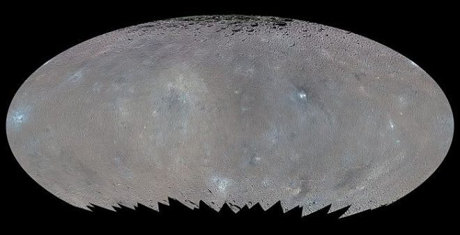 Ceres, as imaged by the spacecraft Dawn on a high altitude orbit 900 miles from the surface. The several bright spots on the asteroid have been of particular interest to scientists and are believed to contain salts and ice. The image is mosaic formed from a series of images.  (NASA/JPL-Caltech)