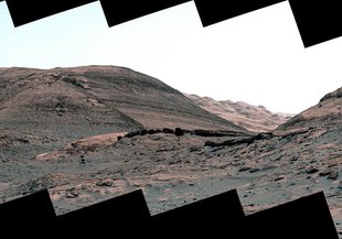 NASA's Curiosity Mars rover captured this view of a sulfate-bearing region using its Mastcam on May 2, 2022. Dark boulders seen near the center are thought to have formed from sand deposited in ancient streams or ponds.