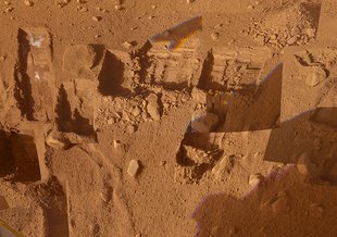 This mosaic of images from the Surface Stereo Imager camera on NASA's Phoenix Mars Lander shows several trenches dug by Phoenix, plus a corner of the spacecraft's deck.
