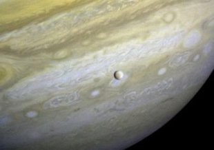 Voyager 1 took photos of Jupiter and two of its moons (Io, left, and Europa) on Feb. 13, 1979. Credit: NASA/JPL