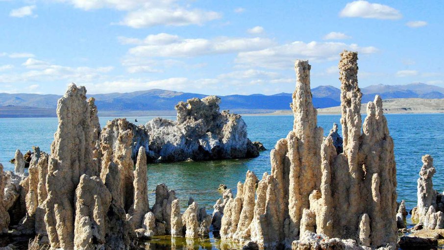 Mono Lake, California, with salt pillars known as "tufas" visible. JPL scientists tested new methods for detecting chemical signatures of life in the salty waters here, believing them to be analogs for water on Mars or ocean worlds like Europa. Image Credit: Mono County Tourism