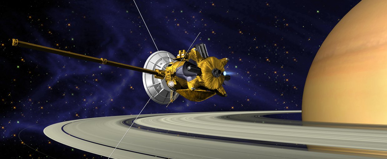 Artwork showing Cassini flying toward the camera. It looks as if the spacecraft is cruising over the rings of Saturn with the planet visible in the background to the right of the frame.