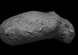 The model shows the asteroid from the side against a black background. The asteroid is somewhat bean-shaped. It is long with two rounded ends. One end is more bulbous than the other and it is bent in the middle.