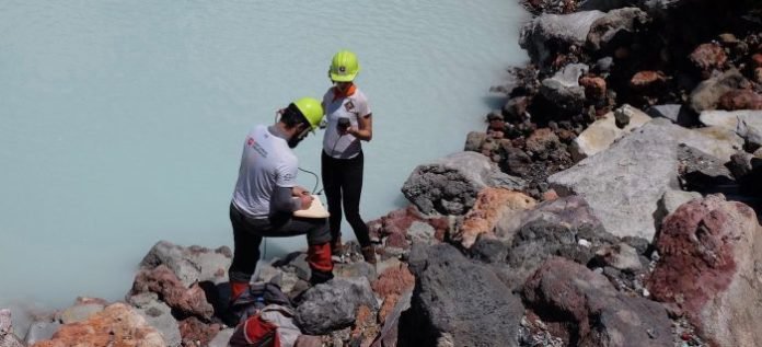 Donato Giovannelli and Karen Lloyd collect samples from the crater lake in Poás Volcano in Costa Rica.