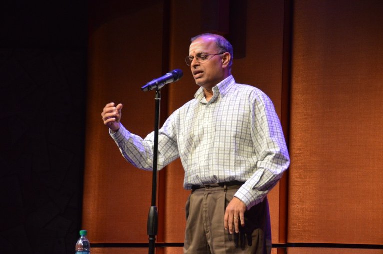 Professor Ramanarayanan Krishnamurthy speaks at a Story Collider event at the San Diego Festival of Science and Engineering.