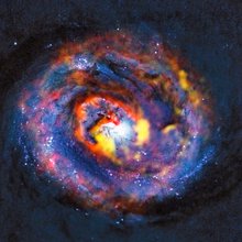 This detailed view shows the central parts of the nearby active galaxy NGC 1433. The coloured structures near the center are from ALMA observations that have revealed a spiral shape, as well as an unexpected outflow, for the first time.
