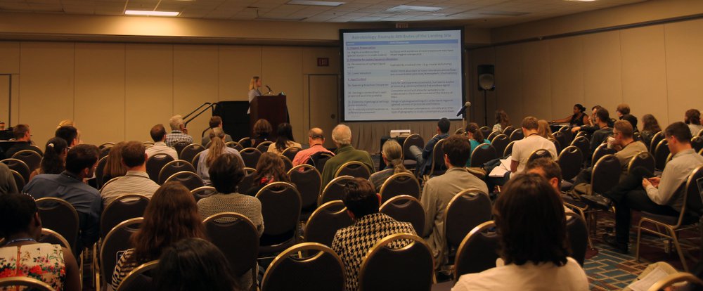 Topical sessions took place throughout the meeting rooms of the Chicago Hilton during the week. Above, Dr. Lindsay Hays of the Mars Program Office at NASA JPL speaks to an audience about astrobiology input into the landing site selection for the upcoming 