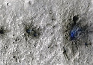 These craters were formed by a Sept. 5, 2021, meteoroid impact on Mars, the first to be detected by NASA’s InSight. Taken by NASA’s Mars Reconnaissance Orbiter, this enhanced-color image highlights the dust and soil disturbed by the impact in blue.