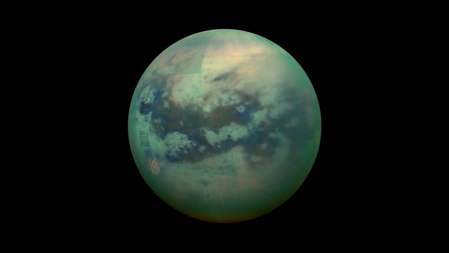 A false-color view of Titan, a moon of Saturn surrounded by a thick orange haze. Titan is believed to contain an ocean with an icy crust on top, which will be simulated in future research.