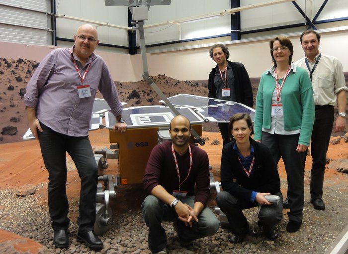 Manish Patel and the NOMAD science team with a prototype of the ExoMars rover in the Mars Yard at ESTEC in the Netherlands.