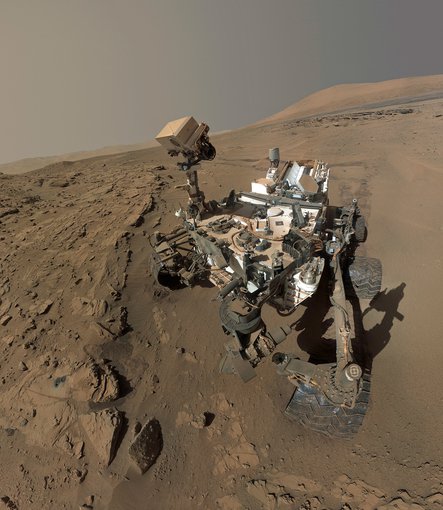 Mars Curiosity rover’s one-year anniversary selfie.  The photo was actually composed of dozens of individual images taken between April and May 2014. Curiosity’s mission is to find evidence of past or present habitable conditions on the surface of Mars.  Credit: NASA