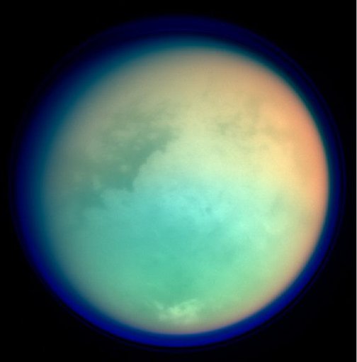 This image shows Titan in ultraviolet and infrared wavelengths. Red and green colors indicate where atmospheric methane is absorbing light, while the blue color shows the upper atmospheric haze.