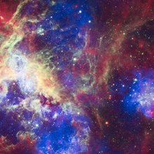 This composite of 30 Doradus, aka the Tarantula Nebula, contains data from Chandra (blue), Hubble (green), and Spitzer (red). Located in the Large Magellanic Cloud, the Tarantula Nebula is one of the largest star-forming regions close to the Milky Way. 