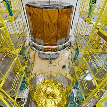 The Gaia star-mapper is lowered into position atop the Fregat upper stage for Soyuz.
