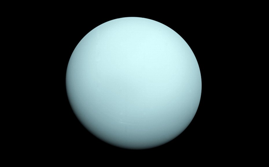 Arriving at Uranus in 1986, Voyager 2 observed a bluish orb with extremely subtle features. A haze layer hid most of the planet's cloud features from view.
